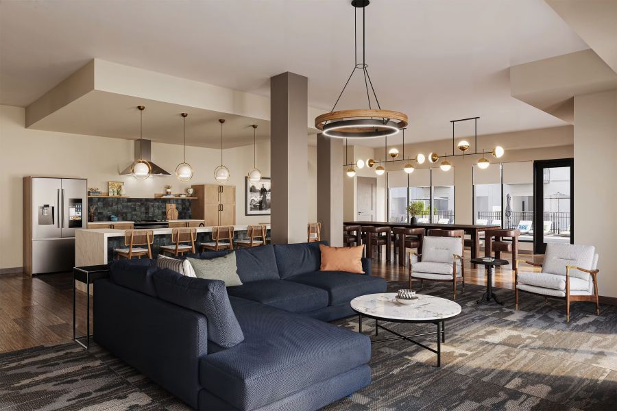 Modern open-concept living room, kitchen, and dining area with stylish furniture and pendant lighting at Bennett Apartments.