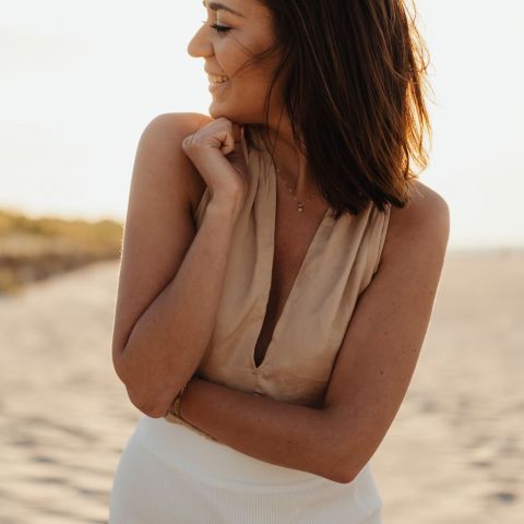 Bennett Smiling resident on a beach at sunset